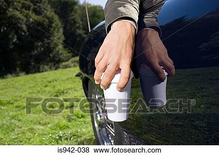 Hand holding coffee cup View Large Photo Image Stock Photo - Hand holding coffee cup. Fotosearch