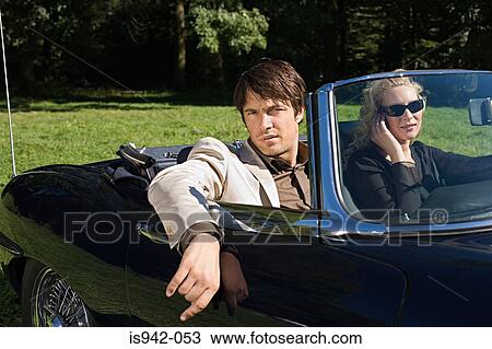 Stylish couple in convertible View Large Photo Image Stock Image - Stylish couple in convertible. Fotosearch