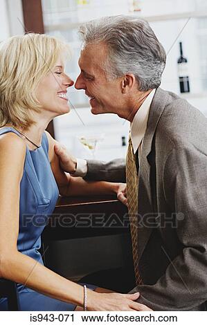 Affectionate couple in bar View Large Photo Image Stock Image - Affectionate couple in bar. Fotosearch