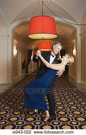 Couple dancing in hotel corridor View Large Photo Image Stock Image - Couple dancing in hotel corridor. Fotosearch