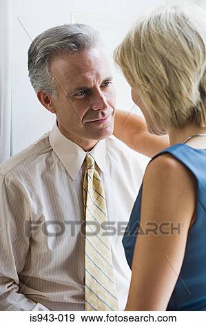 Couple gazing at each other View Large Photo Image Stock Photo - Couple gazing at each other. Fotosearch
