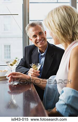 Couple having martinis View Large Photo Image Stock Photography - Couple having martinis. Fotosearch