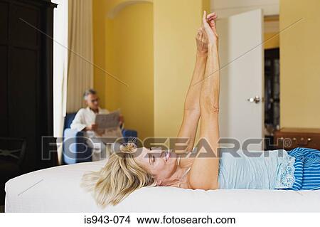 Couple relaxing in hotel room View Large Photo Image Picture - Couple relaxing in hotel room. Fotosearch
