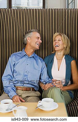Happy couple having coffee View Large Photo Image Stock Photo - Happy couple having coffee. Fotosearch