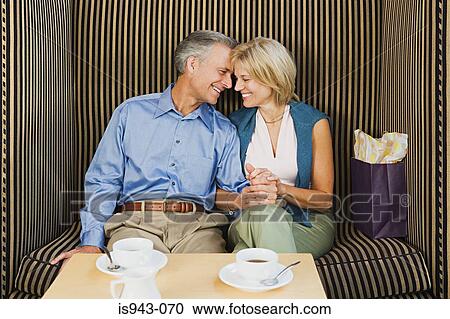 Loving couple having coffee View Large Photo Image Stock Image - Loving couple having coffee. Fotosearch