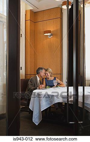 Mature couple having meal View Large Photo Image Stock Image - Mature couple having meal. Fotosearch