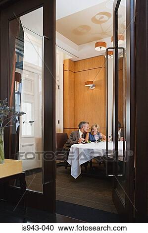Mature couple having meal View Large Photo Image Stock Image - Mature couple having meal. Fotosearch