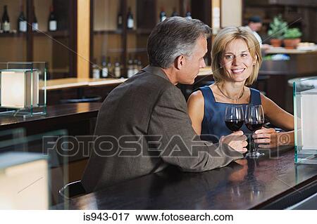 Mature couple in a bar View Large Photo Image Stock Photo - Mature couple in a bar. Fotosearch