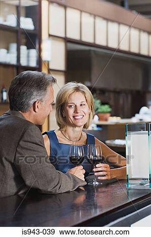Stock Photo - Mature couple in bar. Fotosearch