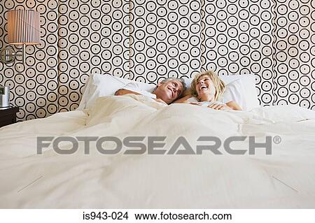 Mature couple in bed View Large Photo Image Picture - Mature couple in bed. Fotosearch