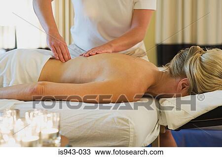 Woman having a massage View Large Photo Image Stock Image - Woman having a massage. Fotosearch