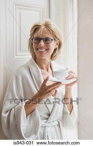 Woman having tea View Large Photo Image Stock Image - Woman having tea. Fotosearch