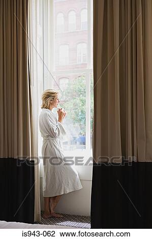 Woman in hotel room View Large Photo Image Stock Image - Woman in hotel room. Fotosearch