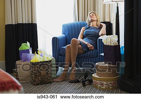 Woman tired from shopping View Large Photo Image Stock Image - Woman tired from shopping. Fotosearch