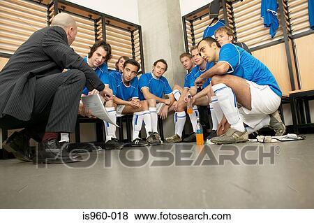 Coach with football team View Large Photo Image Stock Photo - Coach with football team. Fotosearch