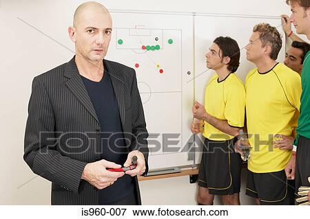 Stock Photo - Coach with soccer team. Fotosearch