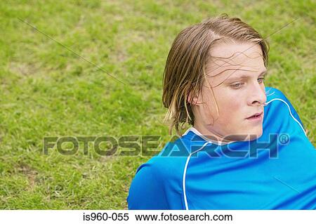 Exhausted footballer View Large Photo Image Stock Photography - Exhausted footballer. Fotosearch