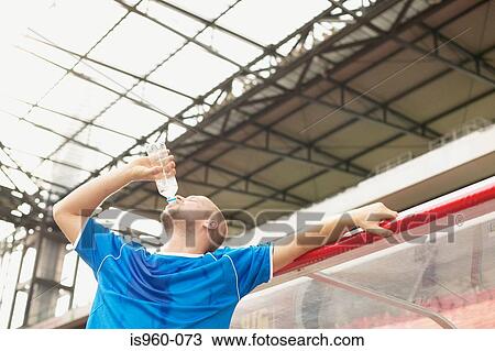 Footballer drinking View Large Photo Image Stock Image - Footballer drinking. Fotosearch