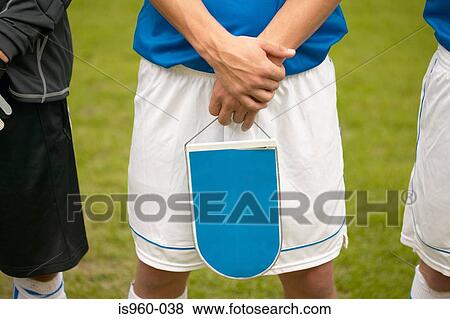 Footballer holding shield View Large Photo Image Stock Photo - Footballer holding shield. Fotosearch