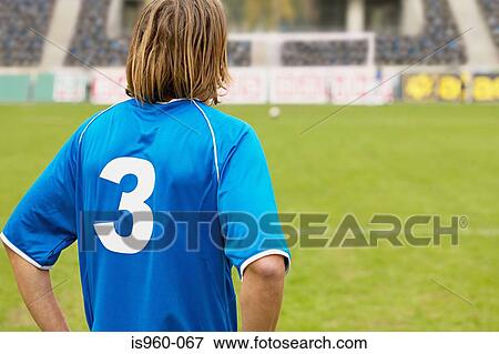 Footballer on the pitch View Large Photo Image Stock Photo - Footballer on the pitch. Fotosearch