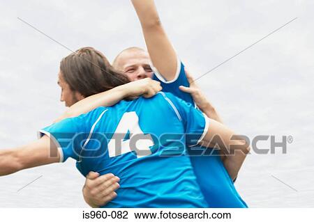 Footballers hugging View Large Photo Image Stock Image - Footballers hugging. Fotosearch