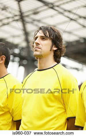 Footballers in yellow View Large Photo Image Stock Photo - Footballers in yellow. Fotosearch