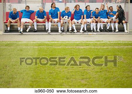 Footballers on the bench View Large Photo Image Stock Image - Footballers on the bench. Fotosearch