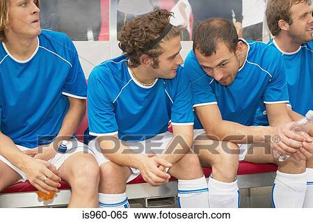 Footballers on the bench View Large Photo Image Stock Photography - Footballers on the bench. Fotosearch