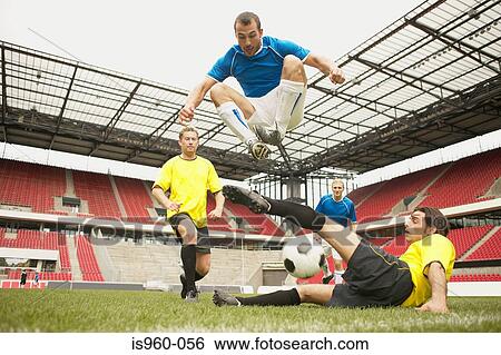 Stock Photograph - Footballers tackling. Fotosearch