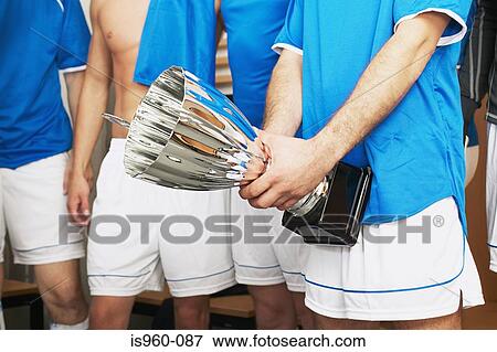 Footballers with trophy View Large Photo Image Stock Photo - Footballers with trophy. Fotosearch