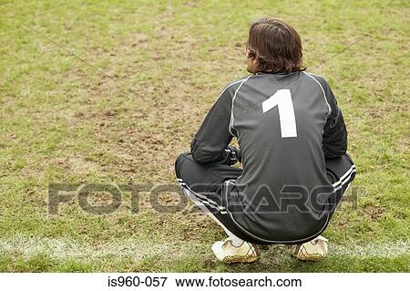 Stock Photo - Goalkeeper crouching. Fotosearch