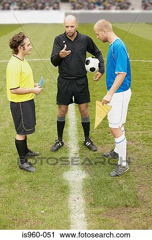 Referee tossing a coin View Large Photo Image Stock Image - Referee tossing a coin. Fotosearch