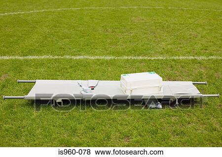 Stretcher and first aid on football pitch View Large Photo Image Stock Photo - Stretcher and first aid on football pitch. Fotosearch