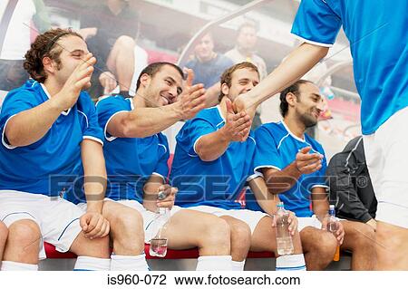 Team congratulating footballer View Large Photo Image Stock Image - Team congratulating footballer. Fotosearch