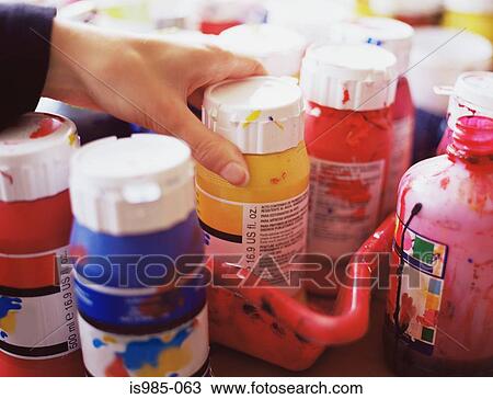 Artist taking a bottle of paint View Large Photo Image Stock Image - Artist taking a bottle of paint. Fotosearch