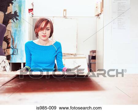 Stock Photo - Girl in art class. Fotosearch