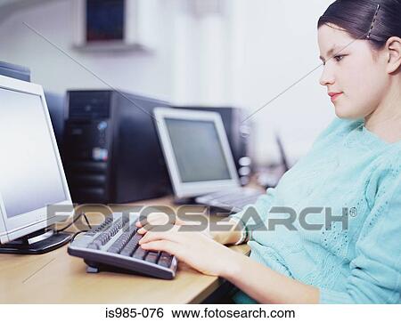 Girl using computer View Large Photo Image Stock Photograph - Girl using computer. Fotosearch
