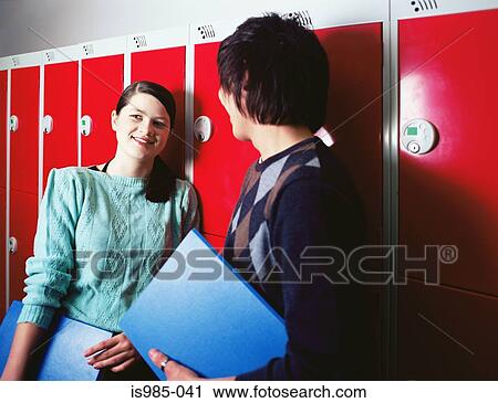 Stock Image - Students in a corridor. Fotosearch