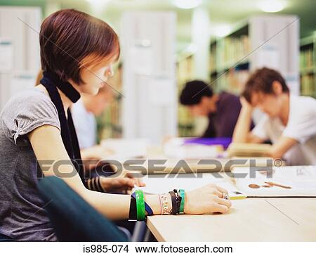 Picture - Students in the library. Fotosearch