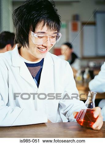 Teenage boy in chemistry class View Large Photo Image Stock Image - Teenage boy in chemistry class. Fotosearch