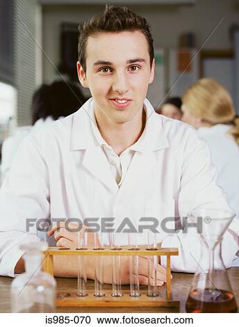 Teenage boy in chemistry class View Large Photo Image Stock Image - Teenage boy in chemistry class. Fotosearch