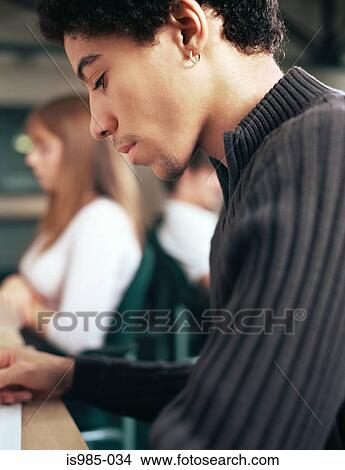 Teenage boy studying View Large Photo Image Picture - Teenage boy studying. Fotosearch