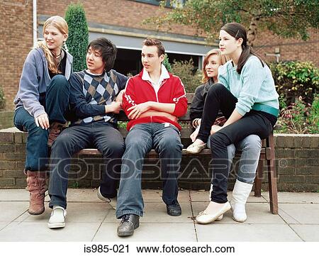Teenagers on a bench View Large Photo Image Stock Image - Teenagers on a bench. Fotosearch