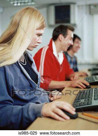 Teenagers using computers View Large Photo Image Stock Photography - Teenagers using computers. Fotosearch