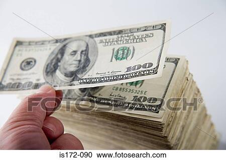 Person stacking hundred dollar bills View Large Photo Image Stock Image - Person stacking hundred dollar bills. Fotosearch