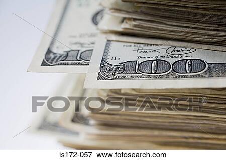 Stock Photo - Pile of hundred dollar bills. Fotosearch