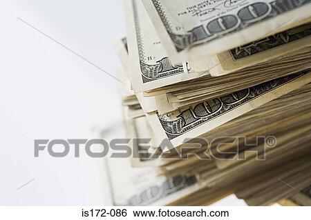 Stock Photograph - Pile of hundred dollar bills. Fotosearch