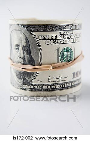 Stock Image - Roll of hundred dollar bills. Fotosearch
