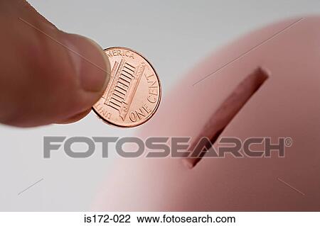 Stock Image - Saving a one cent coin. Fotosearch