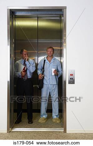 Picture - Businessman at work in his pajamas. Fotosearch